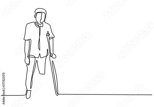 Young man with one leg one continuous line with minimalist design isolated in one white background. Standing male with one leg learning to walk with a stick. Minimalist design. Vector illustration