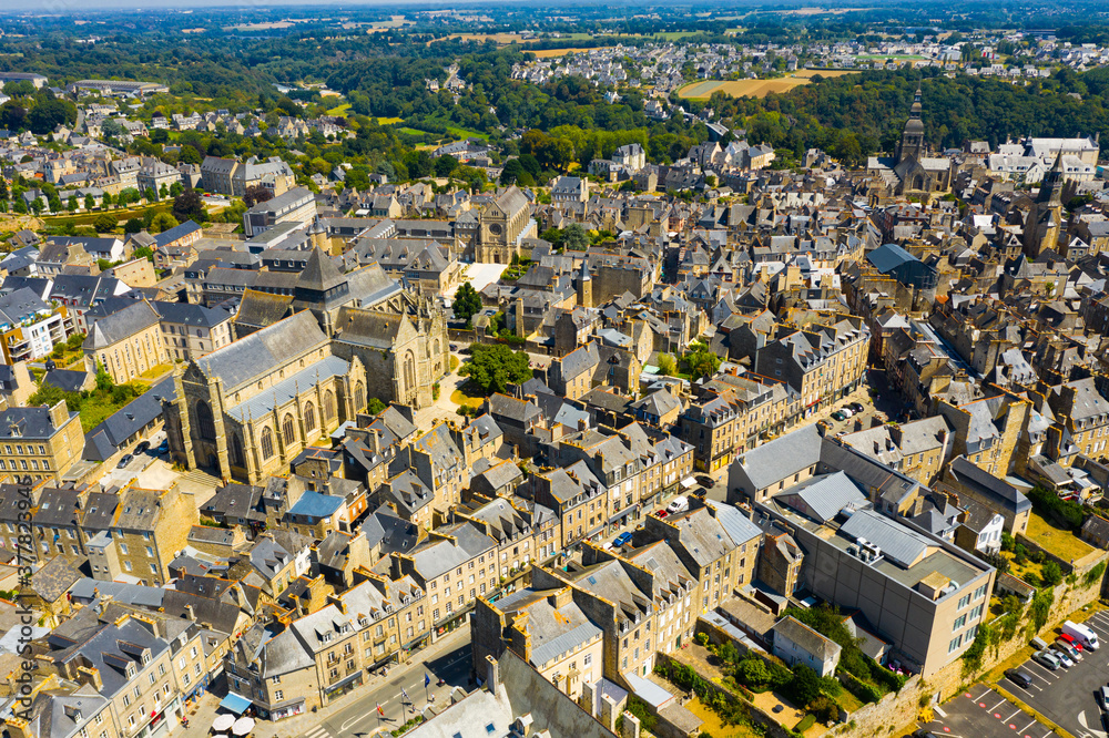 Scenic aerial view of summer cityscape of Dinan overlooking Gothic building of Catholic Church of Saint Malo, France - obrazy, fototapety, plakaty 