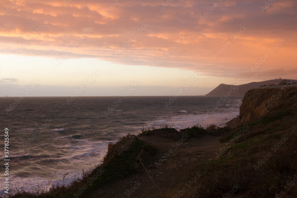 Beautiful seascape view. Sunset sky with sea, pastel colors. Mountains landscape and seacoast. High view to ocean coast waves. Soft focus concept Beautiful seascape view. Sunset sky with sea, pastel colors. Mountains landscape and seacoast. High view to ocean coast waves. Soft focus concept