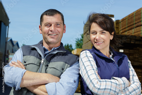 woman and male warehouse supervisor standing outdoors