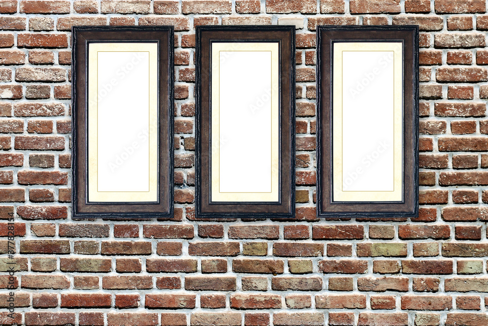 Three empty picture frames on old brick wall Three empty picture frames on old brick wall