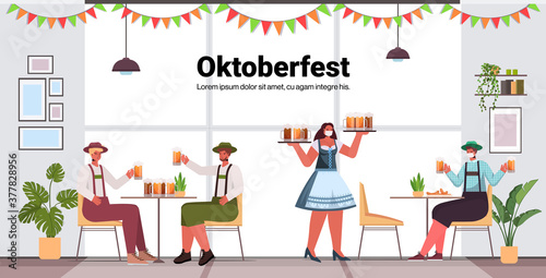 waitress in mask serving beer for men in bar Oktoberfest party celebration coronavirus pandemic concept friends sitting at table having fun horizontal copy space vector illustration