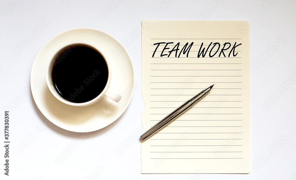TEAM WORK - white paper with pen and coffee on white background TEAM WORK - white paper with pen and coffee on white background