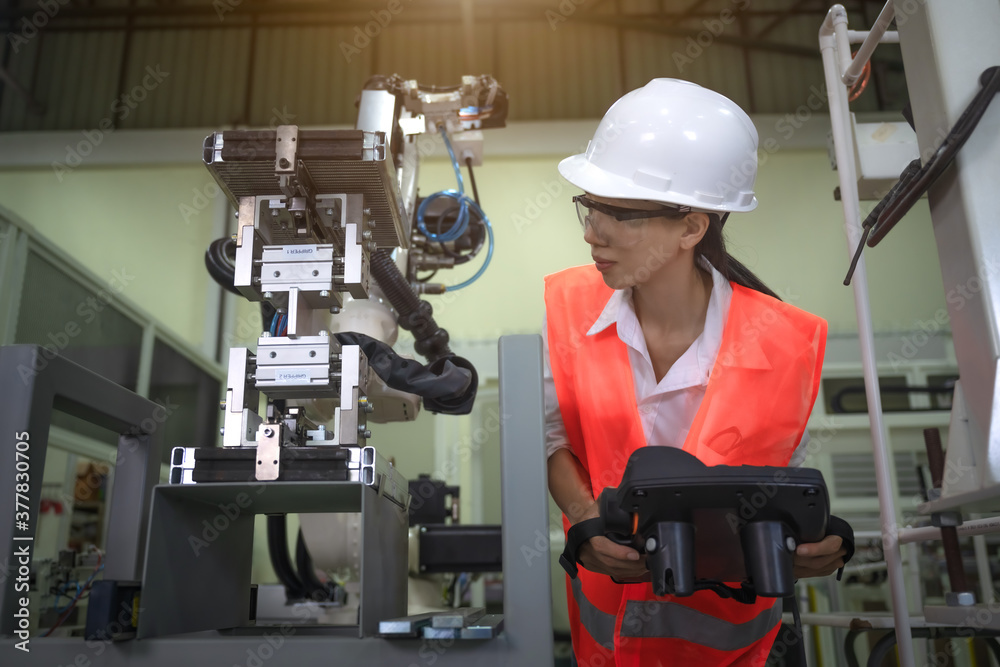 woman working engineering or technical inspection the system of machinery by online mobile device connecting to ensure working in order by checklist part and quality control woman working engineering or technical inspection the system of machinery by online mobile device connecting to ensure working in order by checklist part and quality control
