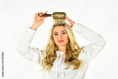 Hot curling brush. Hair care. Hairdresser salon. Professional equipment. Beauty supplies shop. Pretty woman brushing hair isolated on white background. Long hair. Curling Your Hair Much Easier