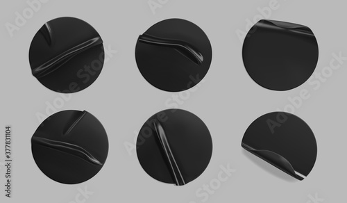 Black glued round crumpled sticker mockup set. Adhesive clear black paper or plastic stickers label with glued, wrinkled effect on grey background. Templates label or price tags. 3d realistic vector