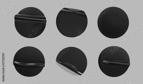 Black glued round crumpled sticker mockup set. Adhesive clear black paper or plastic stickers label with glued, wrinkled effect on grey background. Templates label or price tags. 3d realistic vector