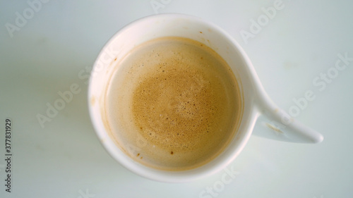 Image with a Cup with Flavored Coffee Mixed with Fresh Milk