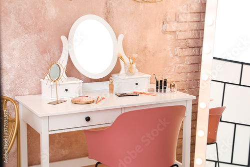 Table with mirror and makeu...