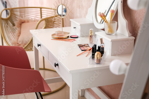 Table with mirror and makeu...