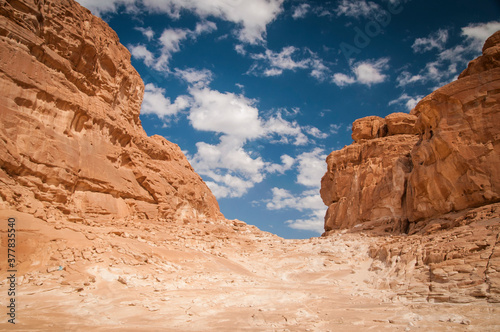 Desert landscape with blue sky and sun