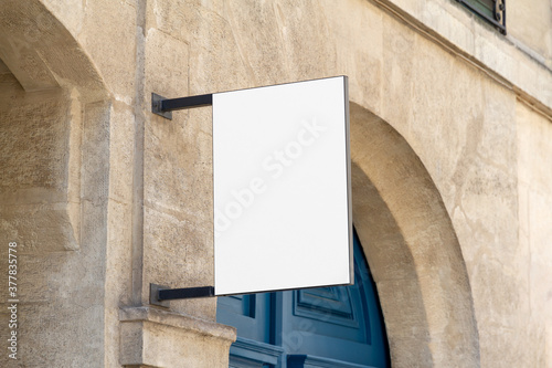 Shop sign Mockup. Rectangular storefront on a wall in street template