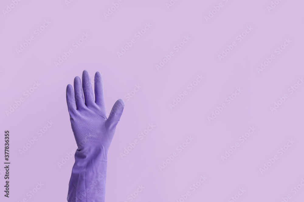 Hand in rubber glove on color background Hand in rubber glove on color background