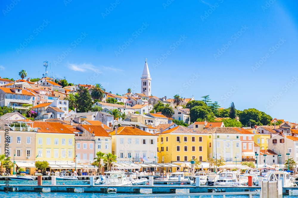 Beautiful town of Mali Losinj on the island of Losinj, Croatia, marina and city skyline with cathedral tower