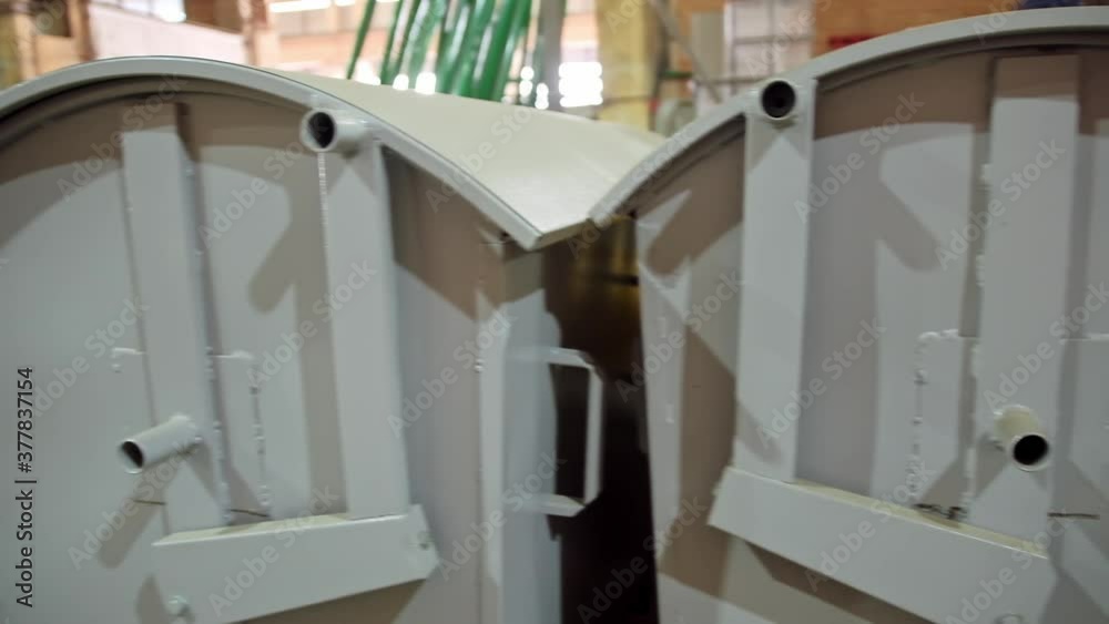 Metal garbage cans. Row of gray iron garbage cans Metal garbage cans. Row of gray iron garbage cans