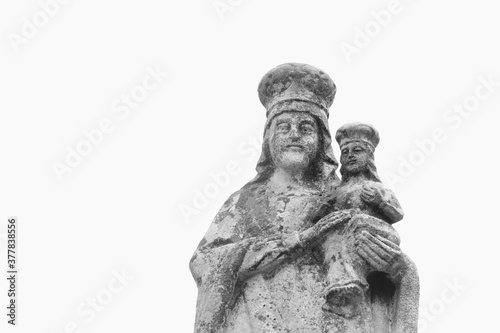 Queen of Heaven. Very ancient stone statue of the Virgin Mary with Jesus Christ isolated on white background.