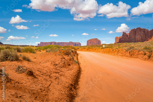 Road and red rocks in Monument Valley. Navajo Tribal Park landscape, Utah/Arizona, USA