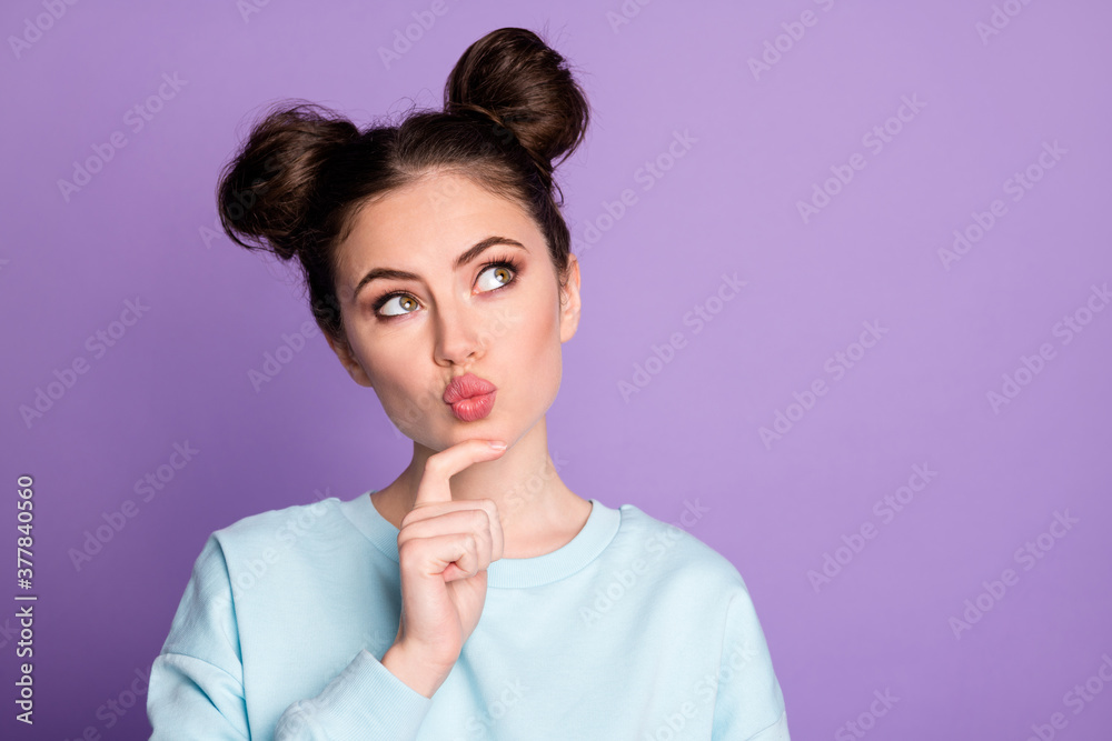 Closeup photo portrait of pretty thoughtful girl making up new plan touching chin isolated over violet background Closeup photo portrait of pretty thoughtful girl making up new plan touching chin isolated over violet background