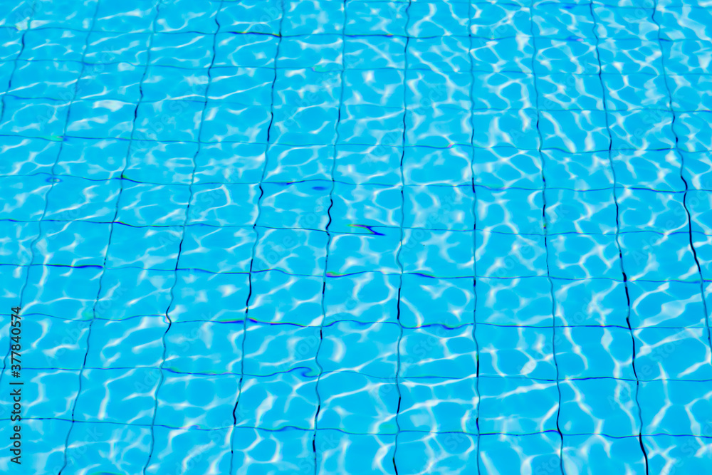 Blue ripe water reflection in swimming pool