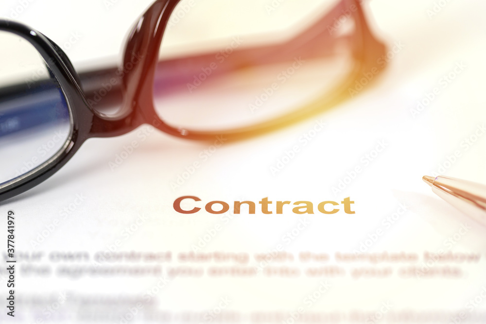 Sign on contract document with fountain pen and glasses Sign on contract document with fountain pen and glasses