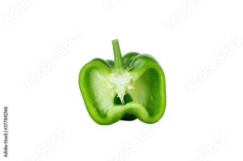 Green raw bell pepper, white background