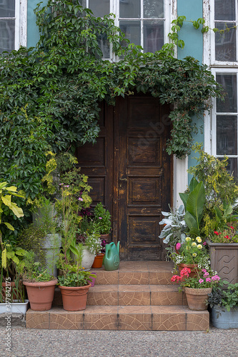 Green Door Of Fairytale Cottage With small garden. Europe © Татьяна Волкова