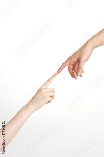 two hands connecting each other with index fingers extended on white background