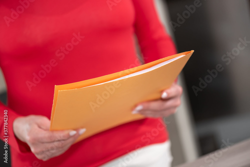 Businesswoman holding folder