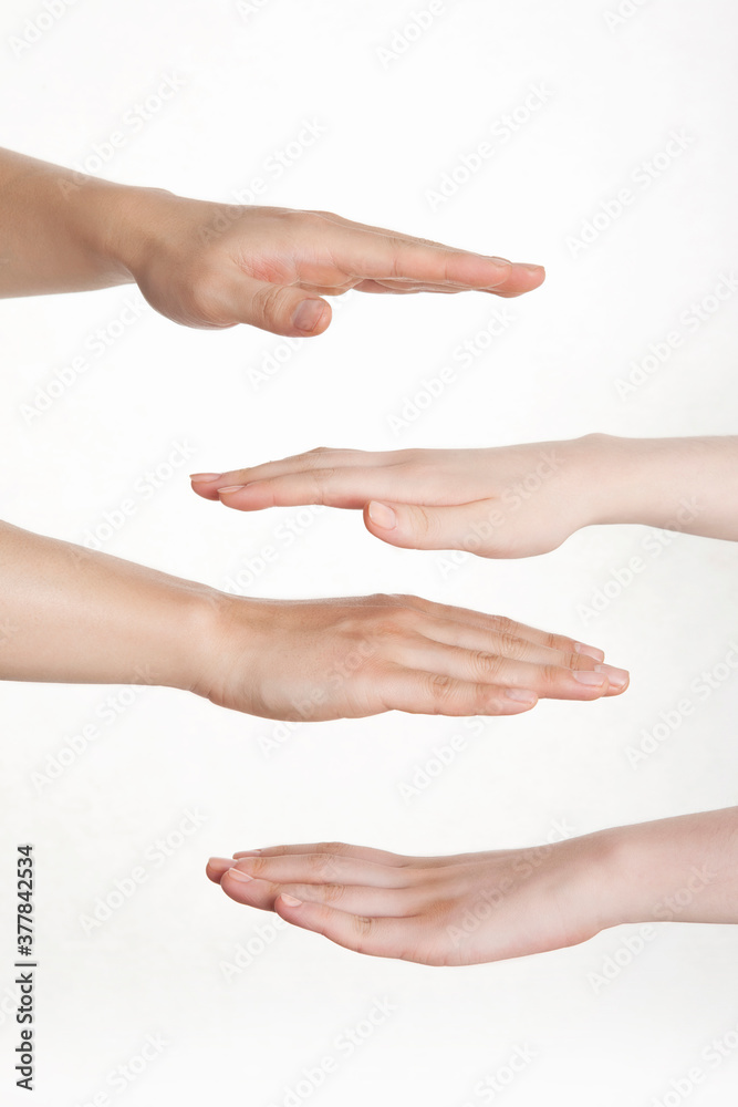 man's and woman's hands on white background