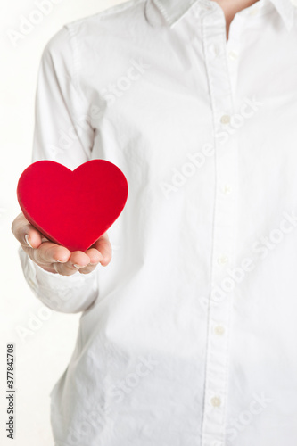 woman holding heart shape box