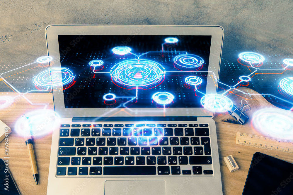 Computer on desktop with social network hologram. Multi exposure. Concept of international people connections. Computer on desktop with social network hologram. Multi exposure. Concept of international people connections.