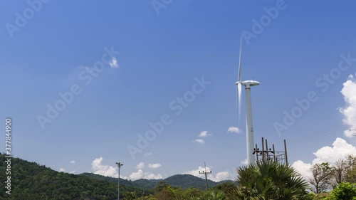 beautiful landscape with the ocean and wind turbine pole