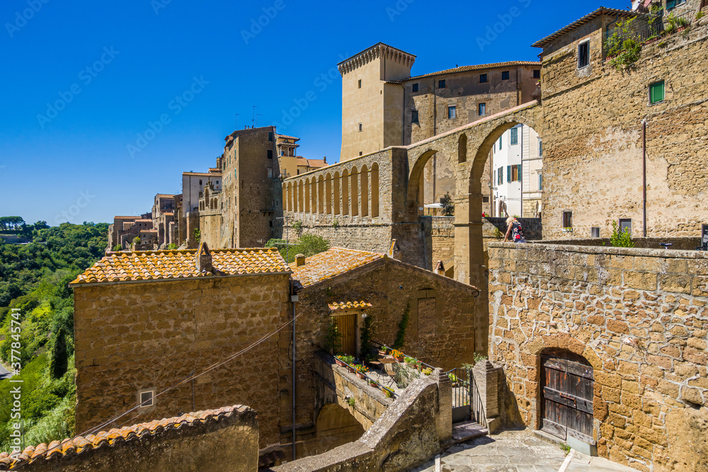 Pitigliano, Tuscany perched on tuff cliff, Old Town and alleys. Splendid town in the Tufo Area, in the heart of Tuscan Maremma, Pitigliano perched on tuff cliff one of most beautiful villages in Italy