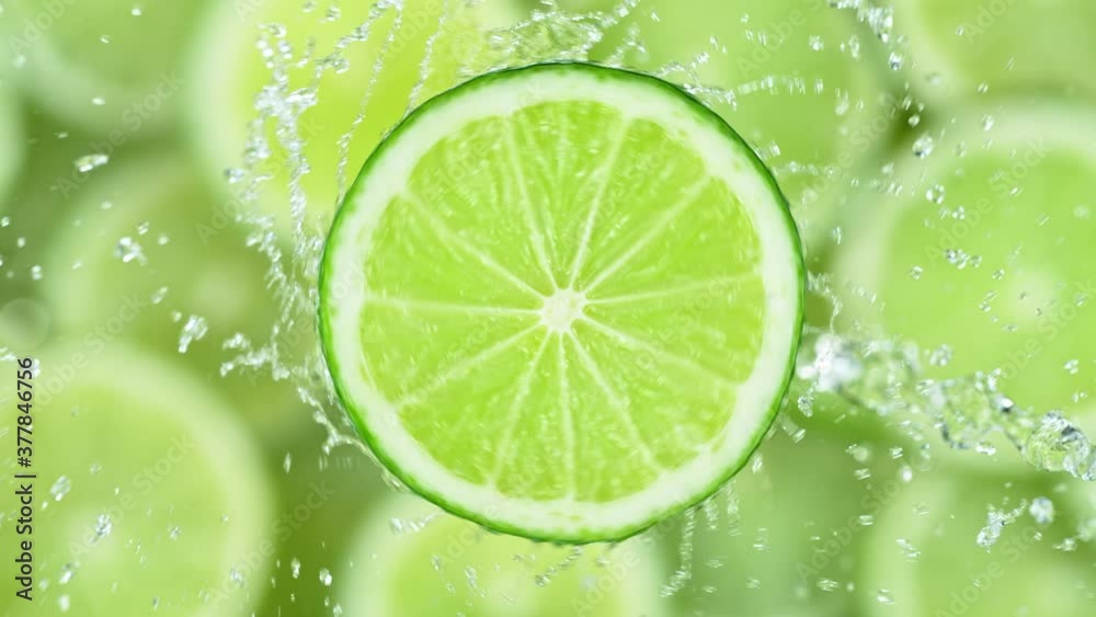 Super Slow Motion Shot of Splashing Water on Rotating Lime Slice at 1000fps. Super Slow Motion Shot of Splashing Water on Rotating Lime Slice at 1000fps.