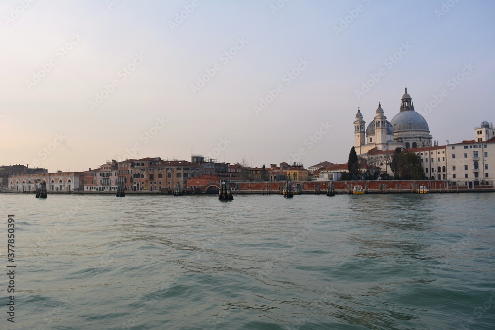 view of venetian lagoon from gondola on grand canal at sunset in Venice Italy view of venetian lagoon from gondola on grand canal at sunset in Venice Italy