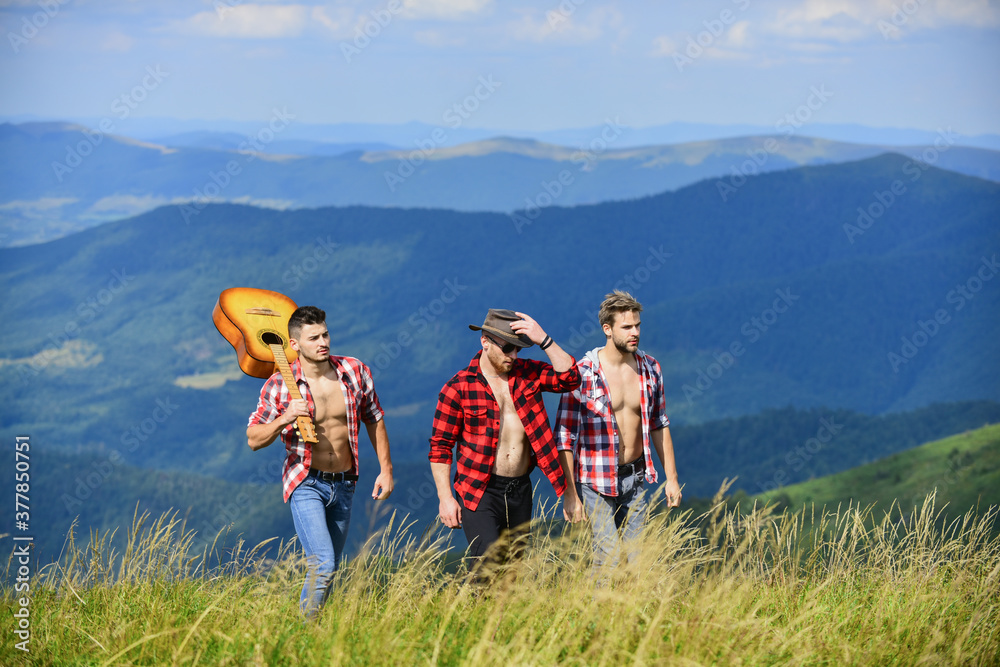 Music - Life. hiking adventure. cowboy men. men with guitar in checkered shirt. western camping. campfire songs. group of people spend free time together. happy men friends with guitar. friendship