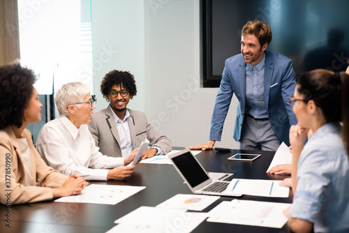 Group of business people working together, brainstorming in office