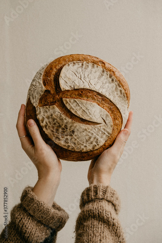 Hands holding sourdough