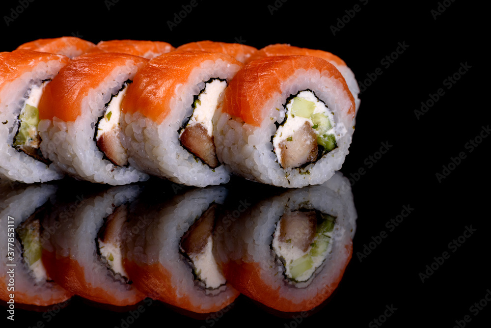Fresh delicious beautiful sushi rolls on a dark background Fresh delicious beautiful sushi rolls on a dark background