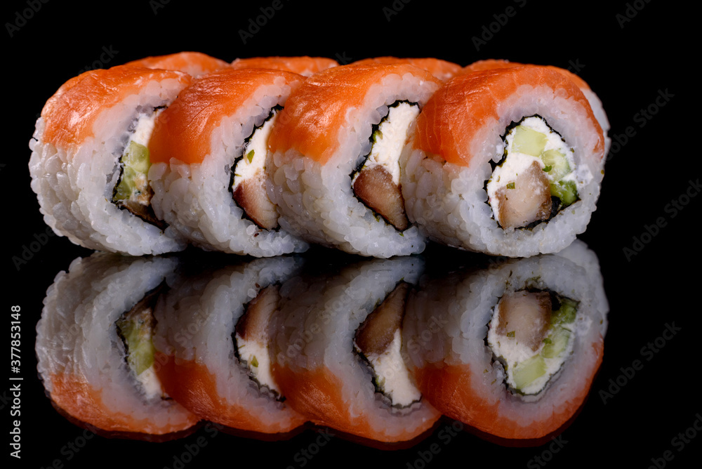 Fresh delicious beautiful sushi rolls on a dark background Fresh delicious beautiful sushi rolls on a dark background