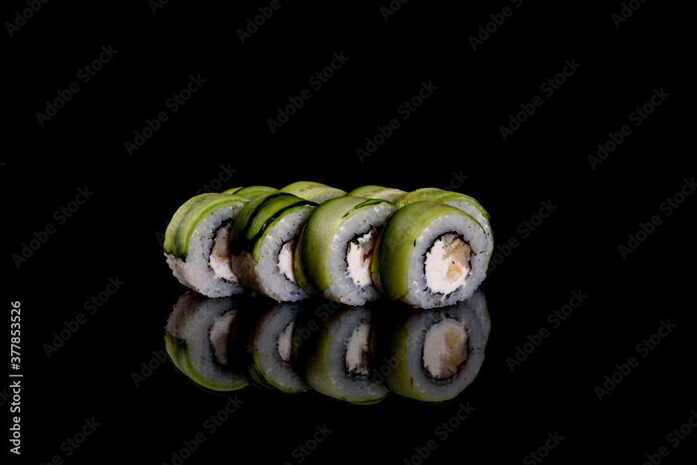 Fresh delicious beautiful sushi rolls on a dark background Fresh delicious beautiful sushi rolls on a dark background