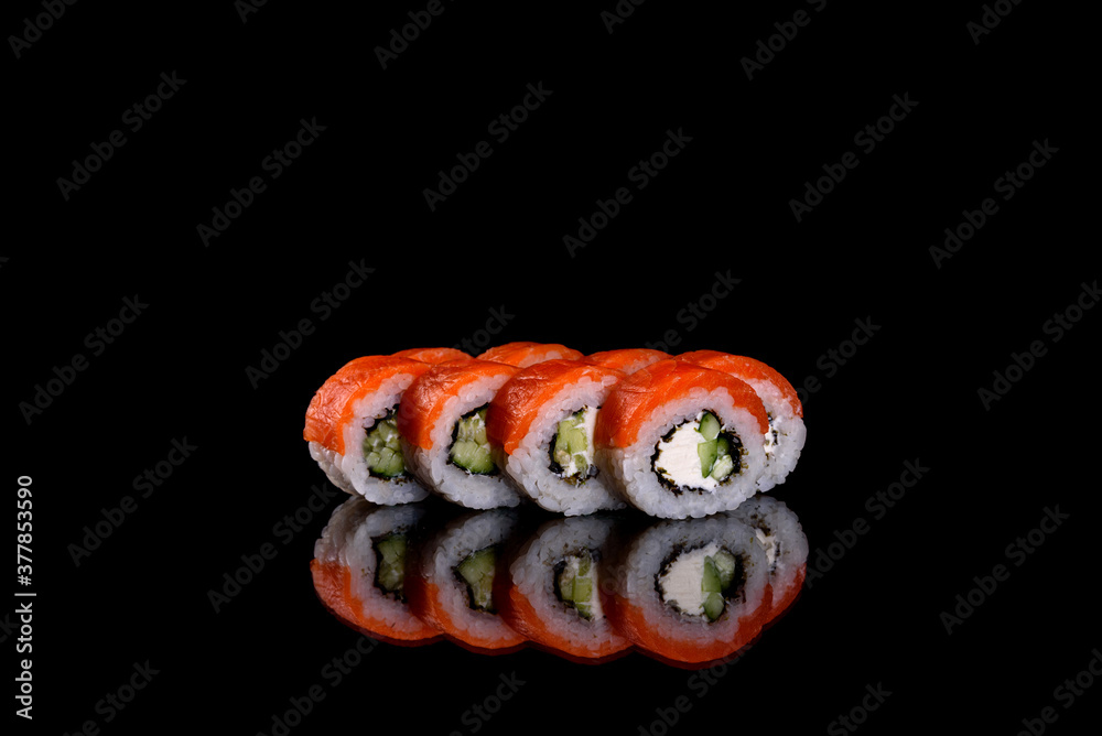 Fresh delicious beautiful sushi rolls on a dark background Fresh delicious beautiful sushi rolls on a dark background