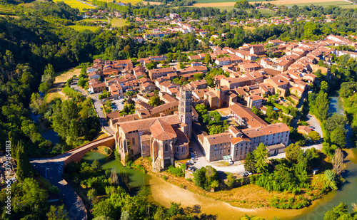General view of French commune of Rieux-Volvestre in sunny summer day looking out over ancient Gothic cathedral, Haute-Garonne department ..