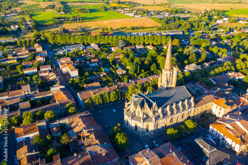 Scenic aerial view of Mirepoix town and surroundings in Hers valley in summer overlooking Gothic building of Roman Catholic Cathedral, France.. photo