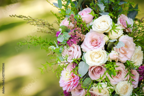 Fresh flower decoration of a wedding arch - pink and white fresh flowers. Fresh roses flower arrangement © miladrumeva
