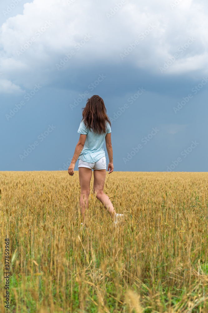 Young Woman In Wheat Field At Summer Young Woman In Wheat Field At Summer