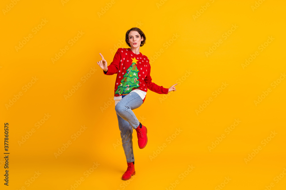 Full body photo of positive energetic girl in christmas tree decor pullover dance on x-mas tradition masquerade party isolated over bright shine color background