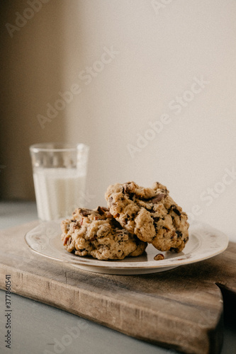 Cookies on a plate with a glass of milk 