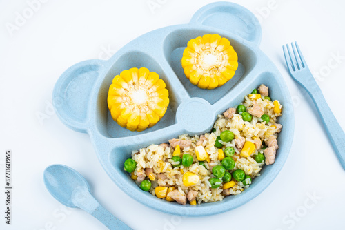 Nutritional meal for children on a plate on white background