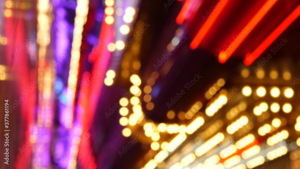 Defocused old fasioned electric lamps glowing at night. Abstract close up of blurred retro casino decoration shimmering, Las Vegas USA. Illuminated vintage style bulbs glittering on Freemont street